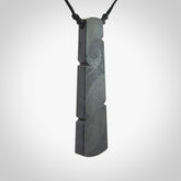Hand made large New Zealand argillite toki pendant. Hand carved in New Zealand by Rueben Tipene. Hand made jewellery. Unique large argillite Toki with adjustable cord. Free shipping worldwide.